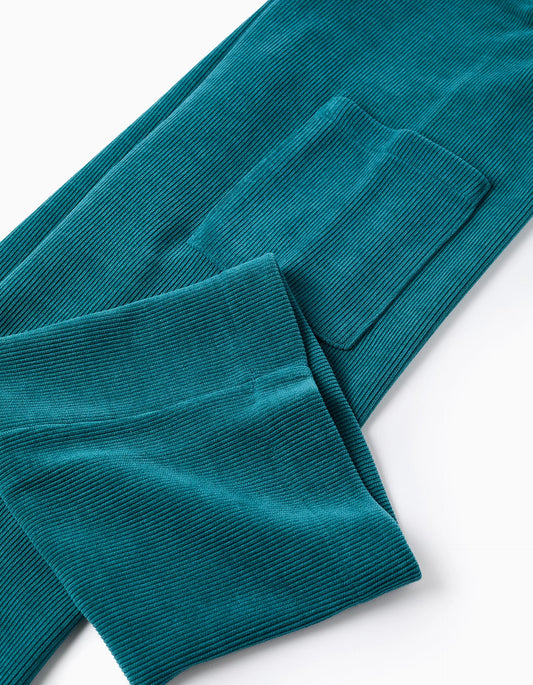 Peto de punto trenzado con bolsillos para niña azul